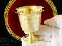 A massive bronze cup.