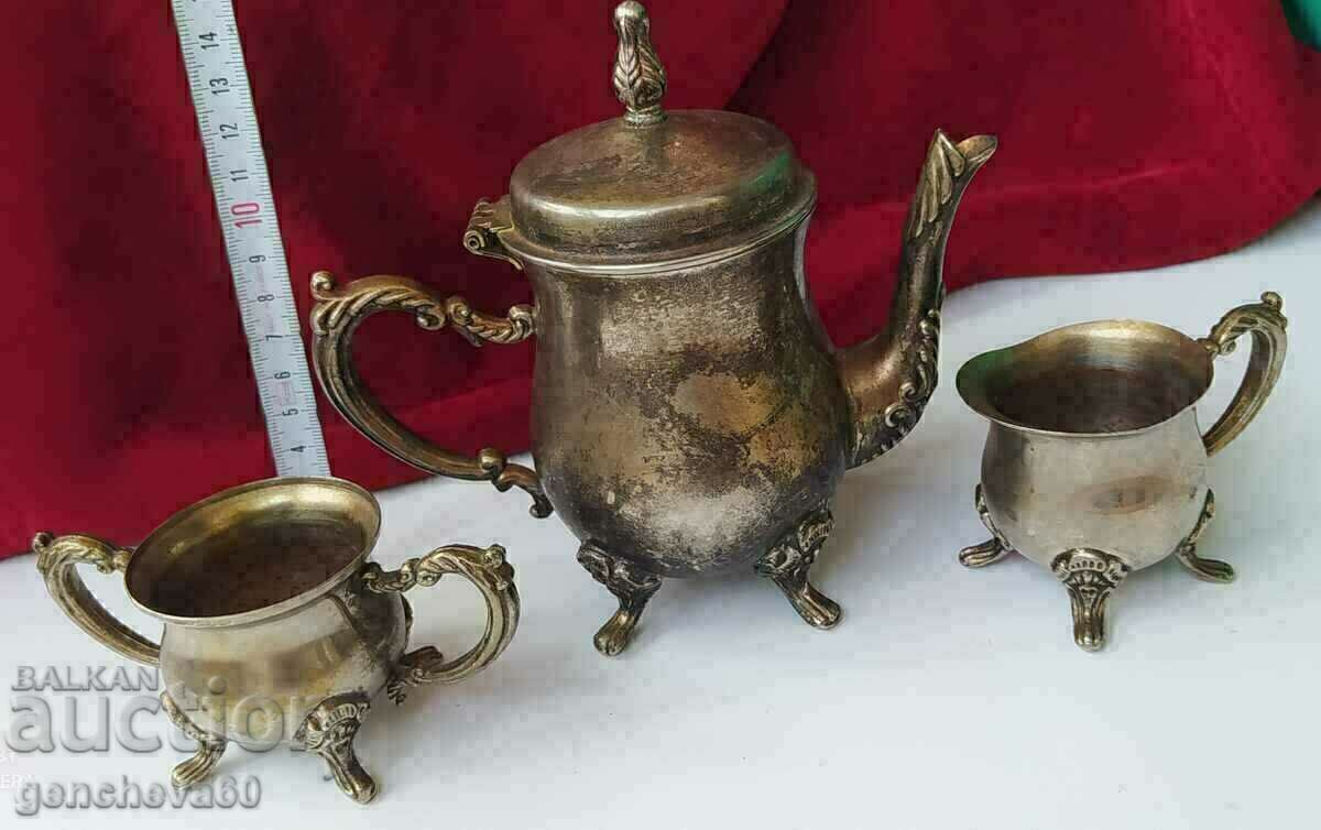 Delivery of Antique teapot, sugar bowl, cup, brass set Delivery of Antique teapot, sugar bowl, cup, brass set