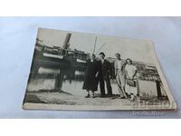 Photo Two men and two women on a wharf on the Danube