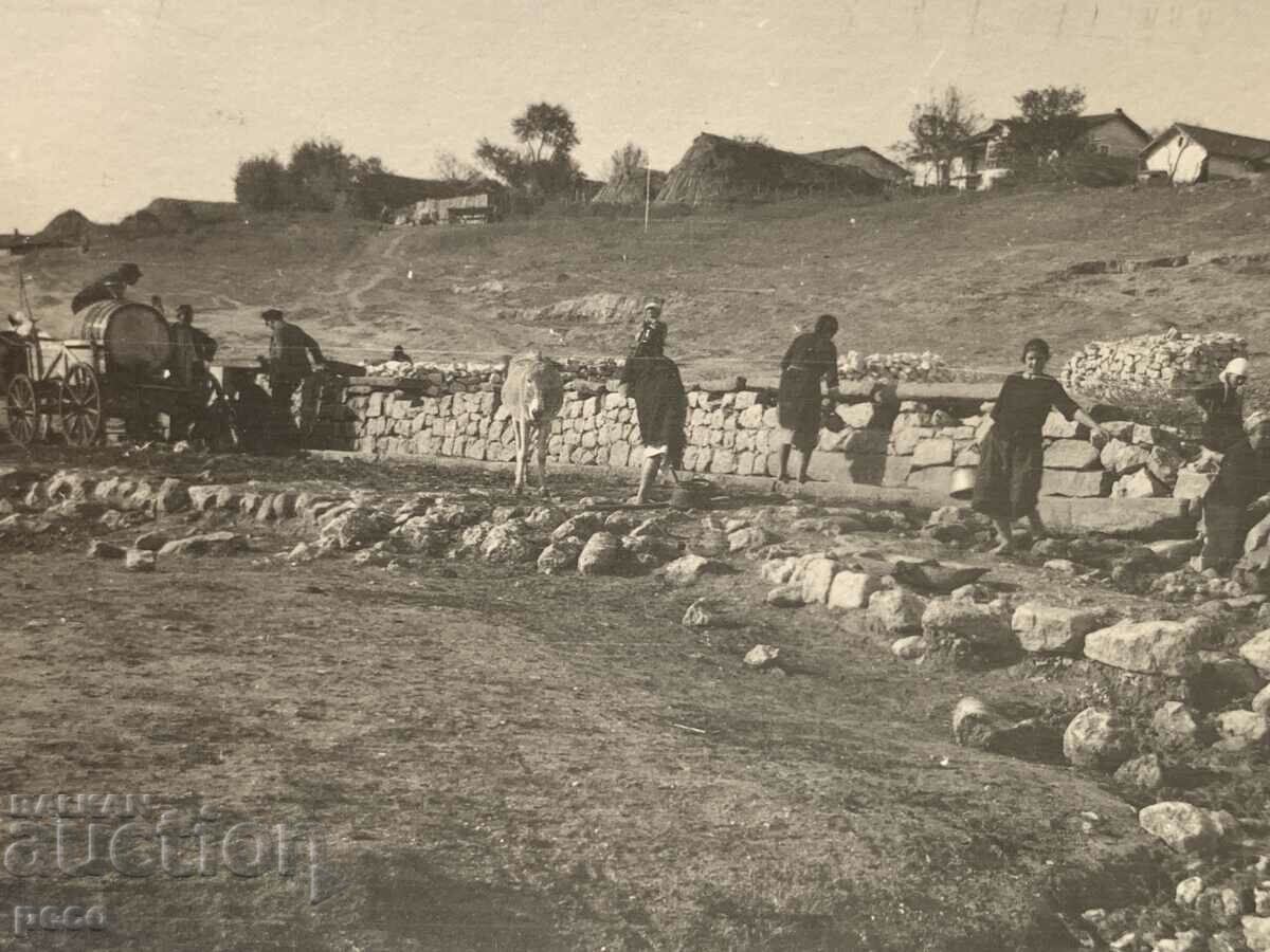 Auction At the Bit and culture fountain, an old photo Auction At the Bit and culture fountain, an old photo