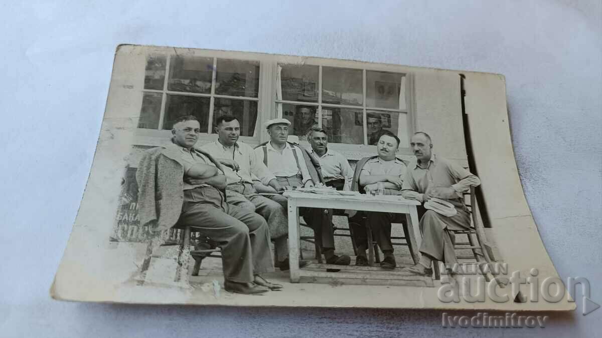 Photo Six men at a table in front of Hotel 1938
