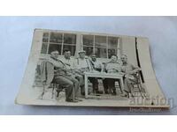 Photo Six men at a table in front of Hotel 1938