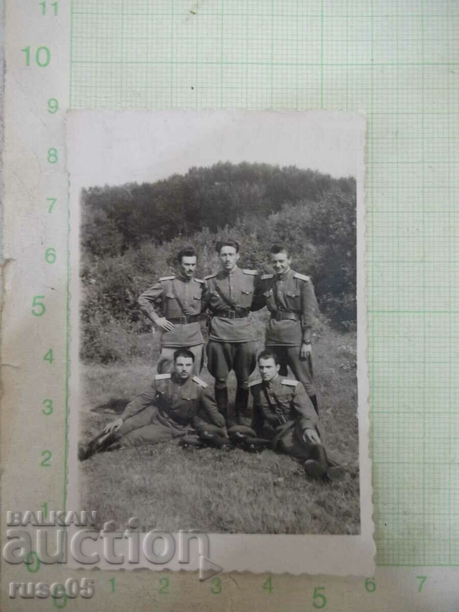 Photo of five young military men