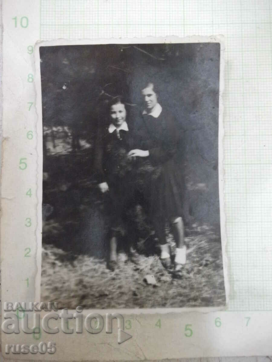 An old photo of two schoolgirls