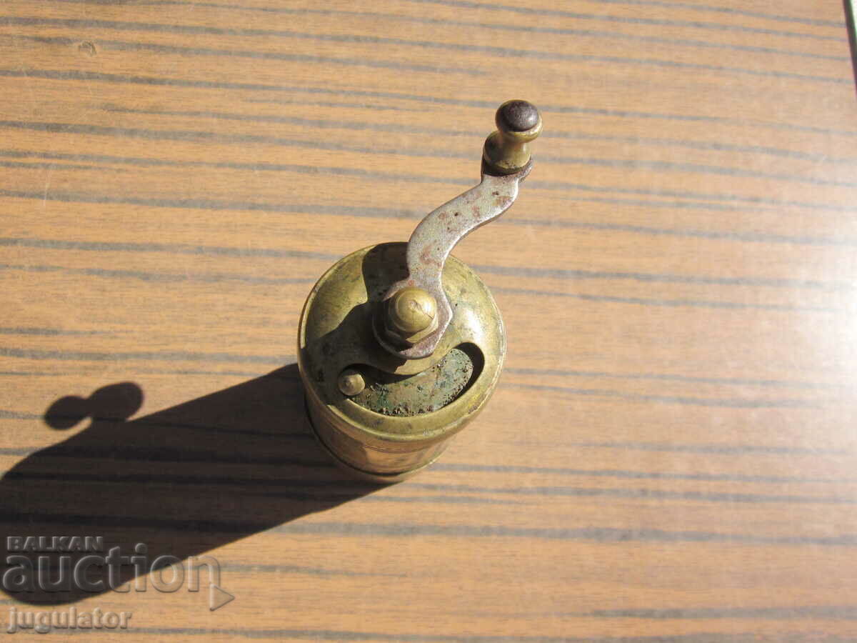 Delivery of old small bronze mechanical pepper mill