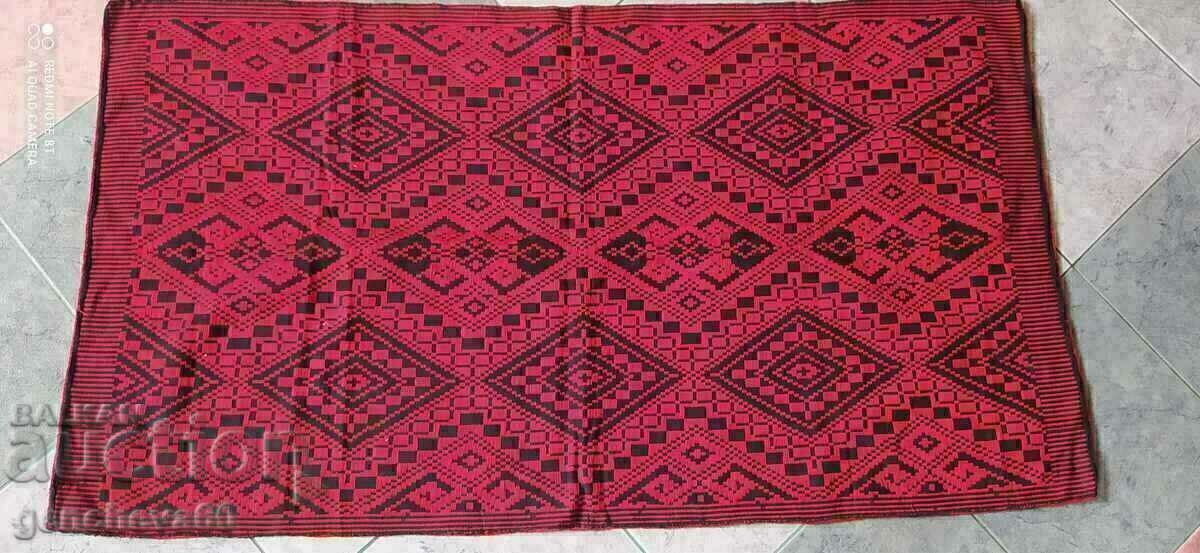 Auction  Antique woven rug in black and red for a folk-style corner