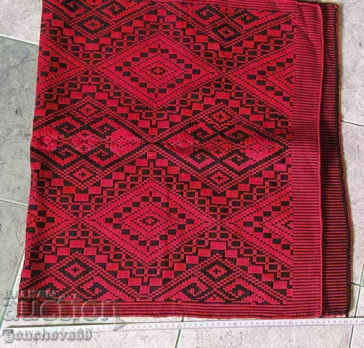 Antique woven rug in black and red for a folk-style corner