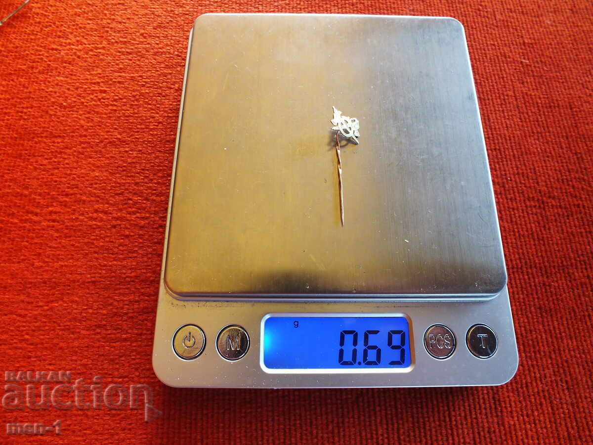 Auction Gold lapel pin Auction Gold lapel pin