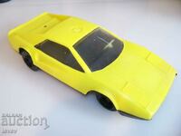 Yellow car with inertial motor, social toy
