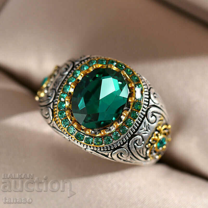 Auction Men's ring with emerald and zircons Auction Men's ring with emerald and zircons