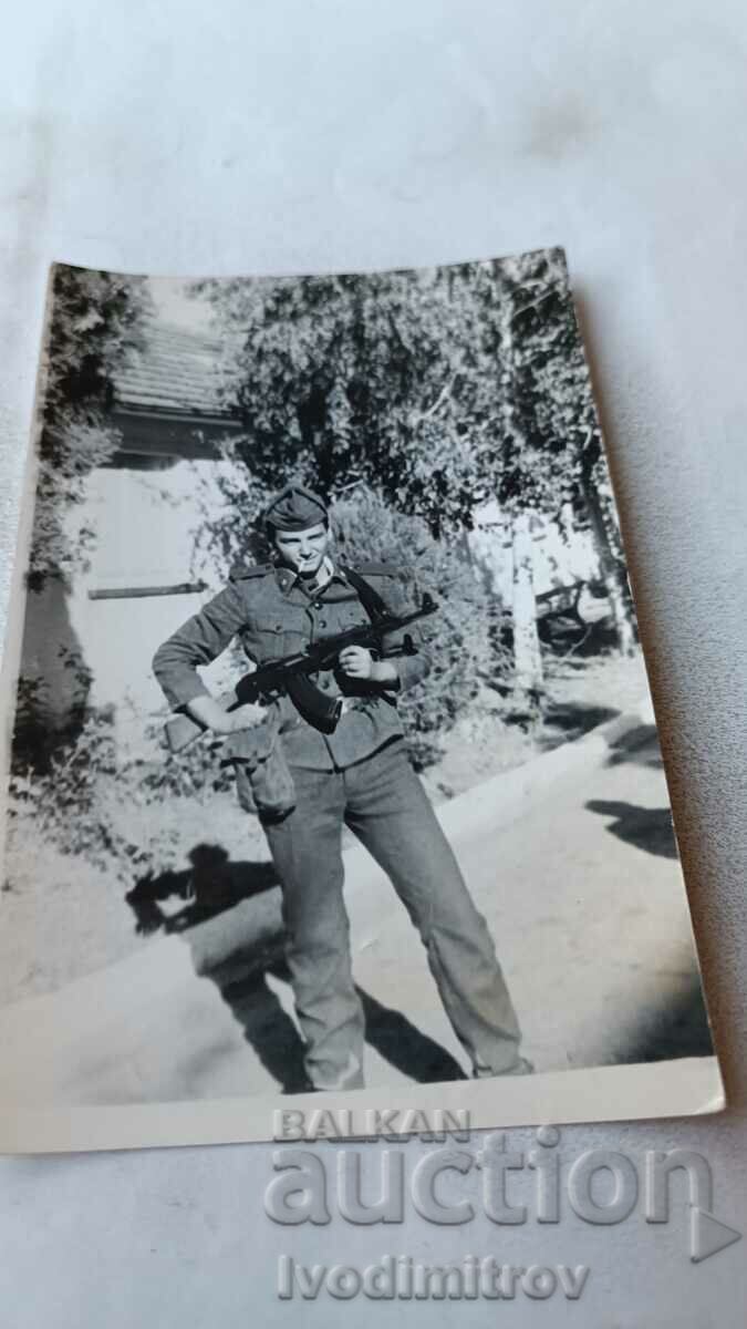 Photo A soldier with a Kalashnikov AK 47 assault rifle