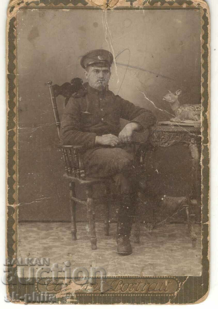 Old photo on cardboard - Seated officer