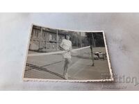 Photo Young woman on a tennis court