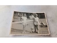 Photo Three women on a tennis court