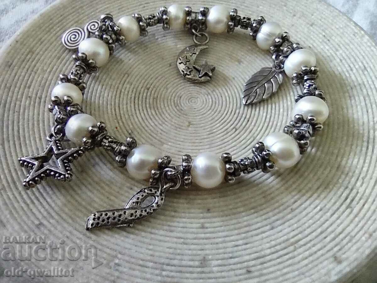 Auction Attractive spectacular BRACELET, natural pearls and pendants Auction Attractive spectacular BRACELET, natural pearls and pendants