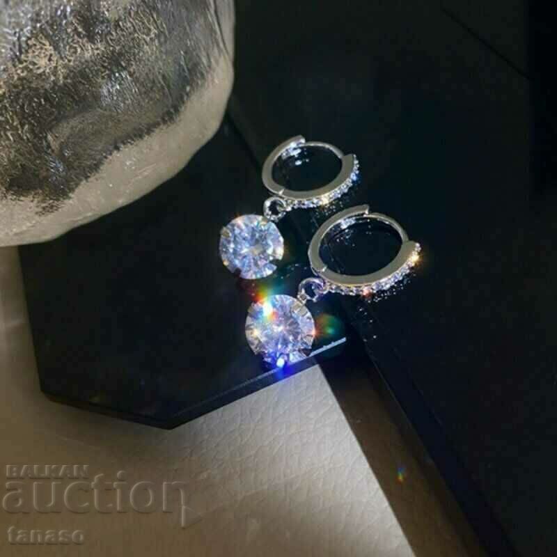 Delivery of Earrings with round zircons - hanging