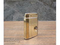 standard old Swiss gilt lighter with later music