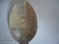 Part of a silver spoon.