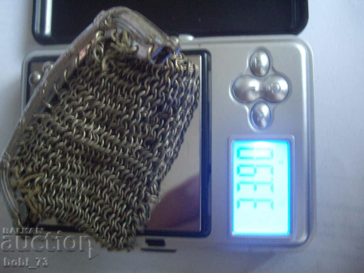 Delivery of Old silver braided purse. Delivery of Old silver braided purse.