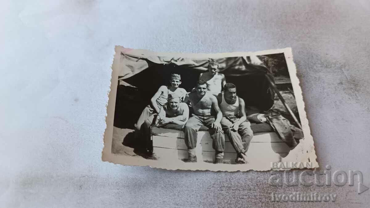 Photo Four soldiers in front of a tent