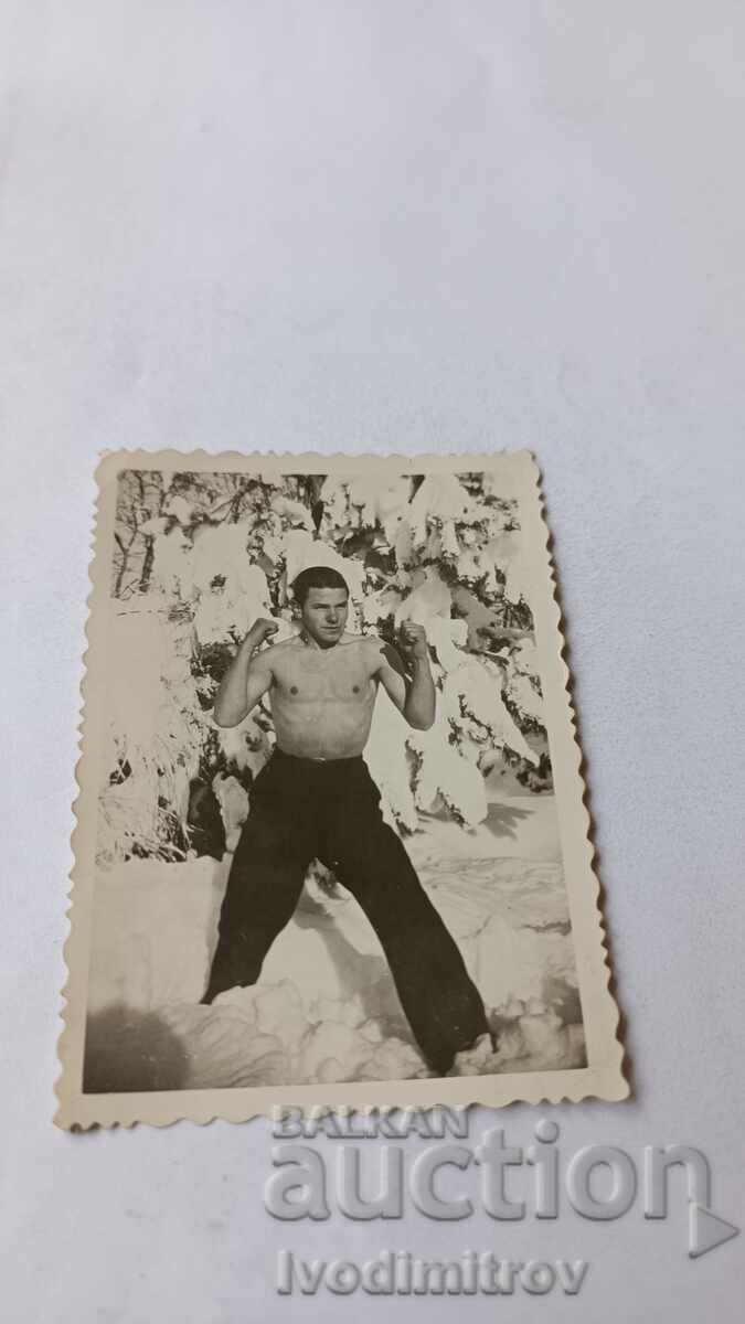 Picture A young man naked to the waist in the snow in the Rosary 1942