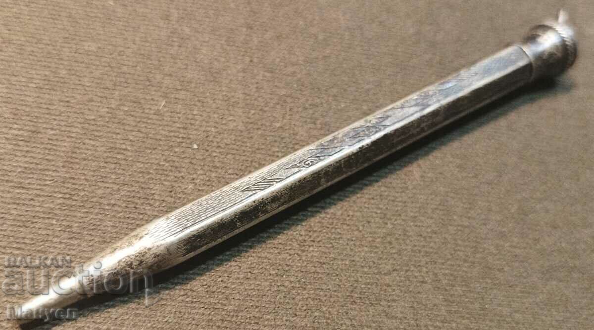 Old silver pencil.