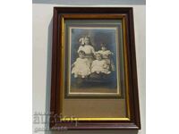 A very old framed photograph of children
