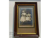 A very old framed photograph of children