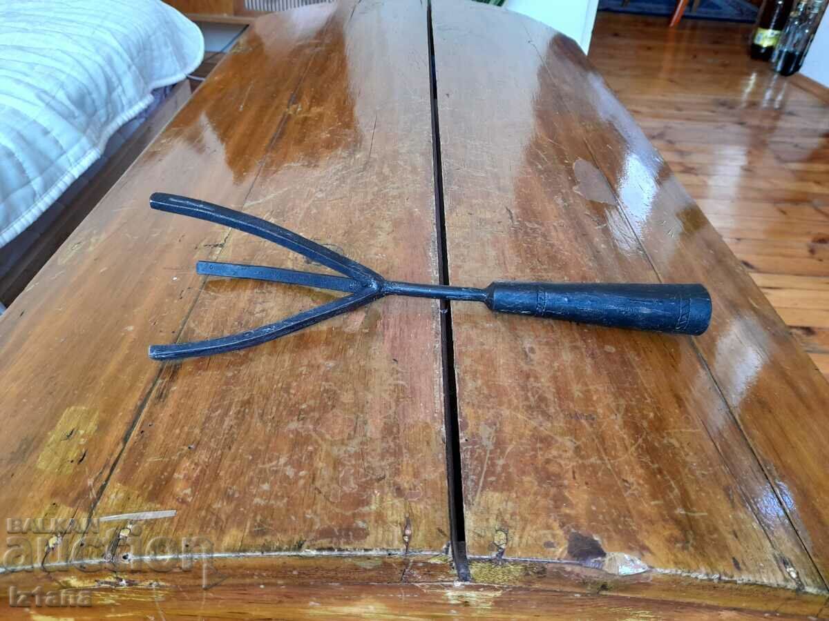 An old device, a tool for picking fruit An old device, a tool for picking fruit