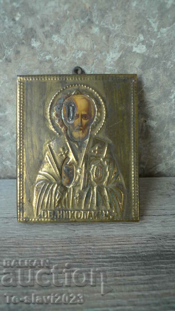 Old icon of St. Nicholas the Wonderworker with ironwork