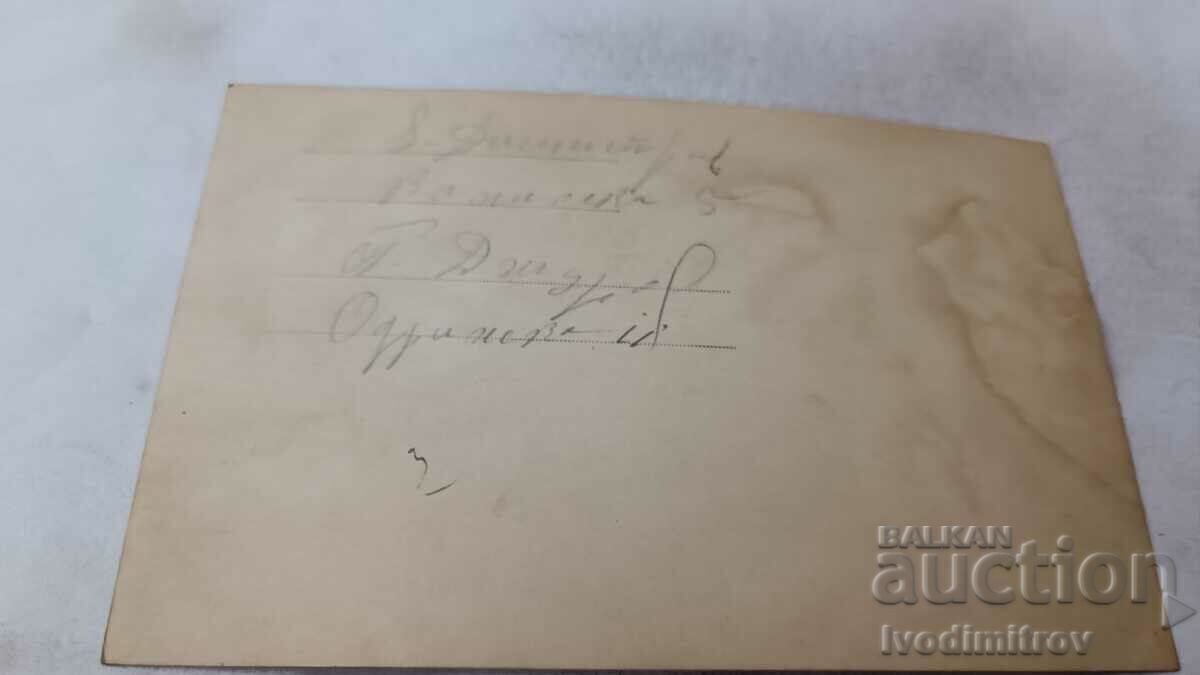 Photo A man in a vintage swimsuit sitting on a stone on the seashore with price 4.85 BGN | € 2.48