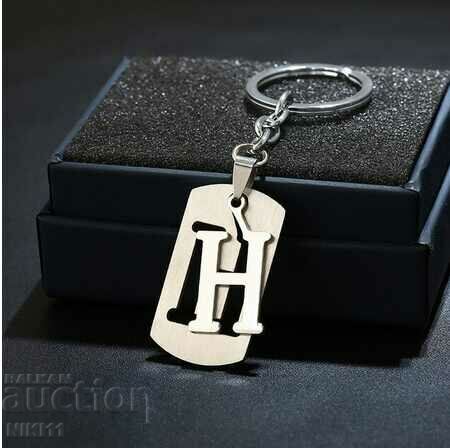 Metal plate with the letter "H" keychain