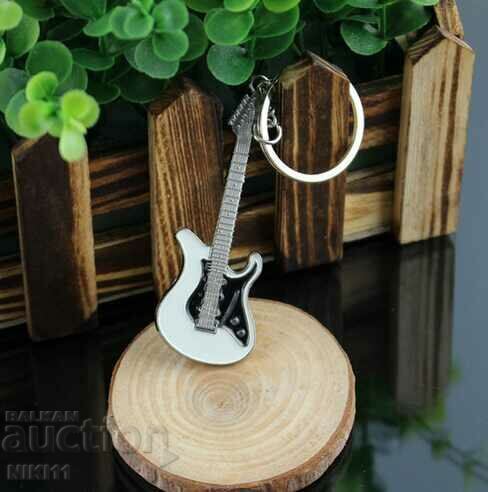 Guitar keychain with price 7.00 BGN | € 3.58 Guitar keychain with price 7.00 BGN | € 3.58