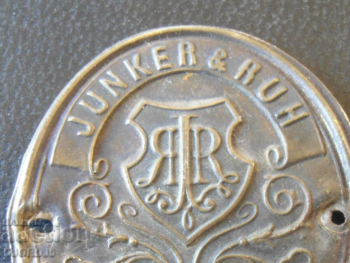 Emblem from an old sewing machine"JUNKER § RUH", KARLSRUHE BADEN with price 5.00 BGN | € 2.56 Emblem from an old sewing machine"JUNKER § RUH", KARLSRUHE BADEN with price 5.00 BGN | € 2.56
