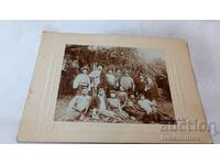 Photo Hunters men woman and hunting dog on a meadow Cardboard