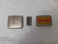 An old lighter and snuffboxes
