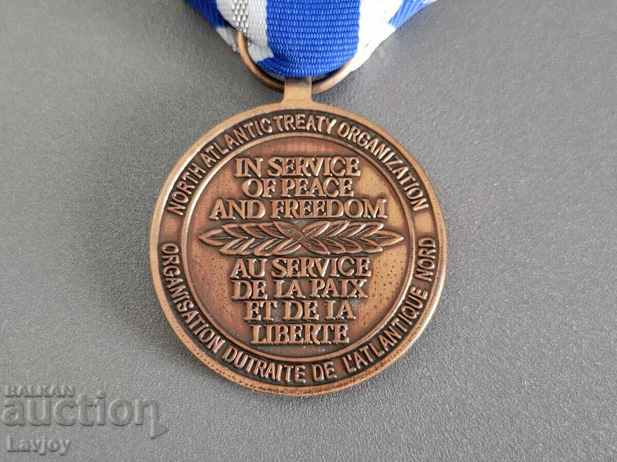 Delivery of NATO military medal with carrier Delivery of NATO military medal with carrier