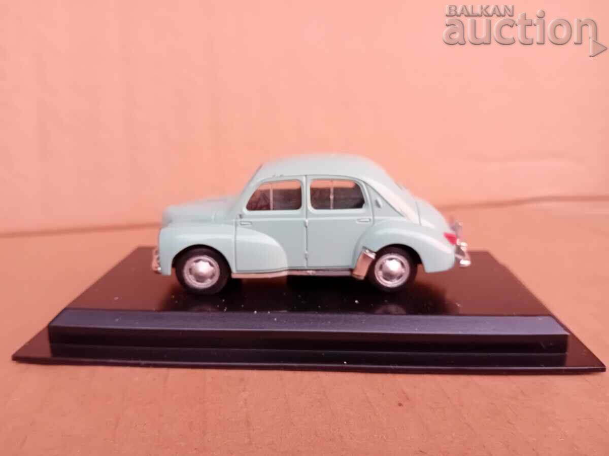 Auction Renault 4CV retro vintage metal toy on stand Auction Renault 4CV retro vintage metal toy on stand