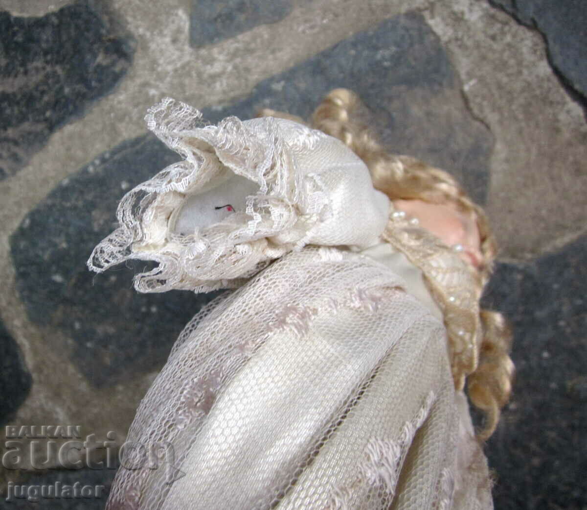 Auction  old porcelain doll with glass eyes marked