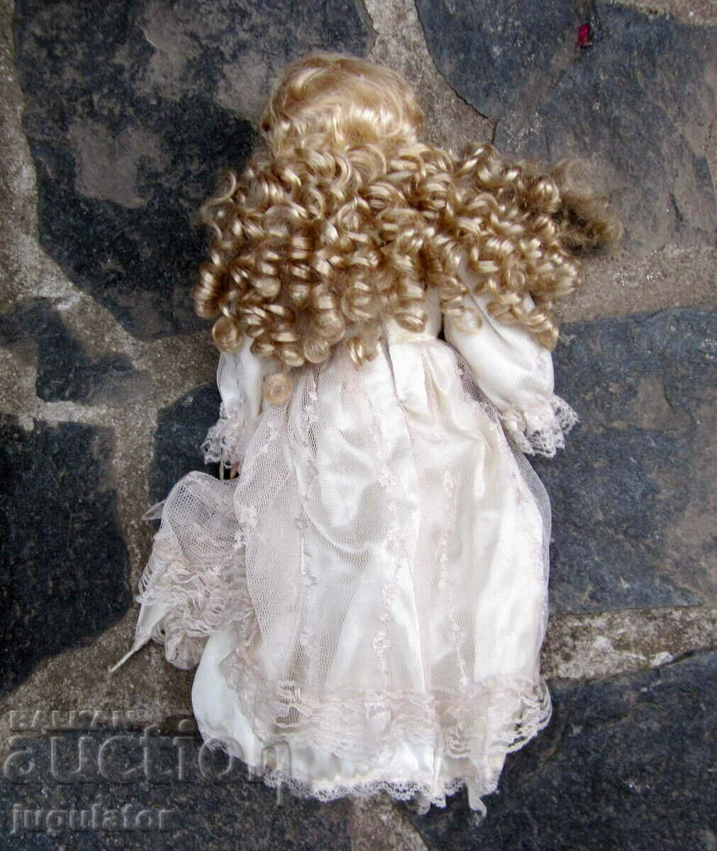 Delivery of old porcelain doll with glass eyes marked