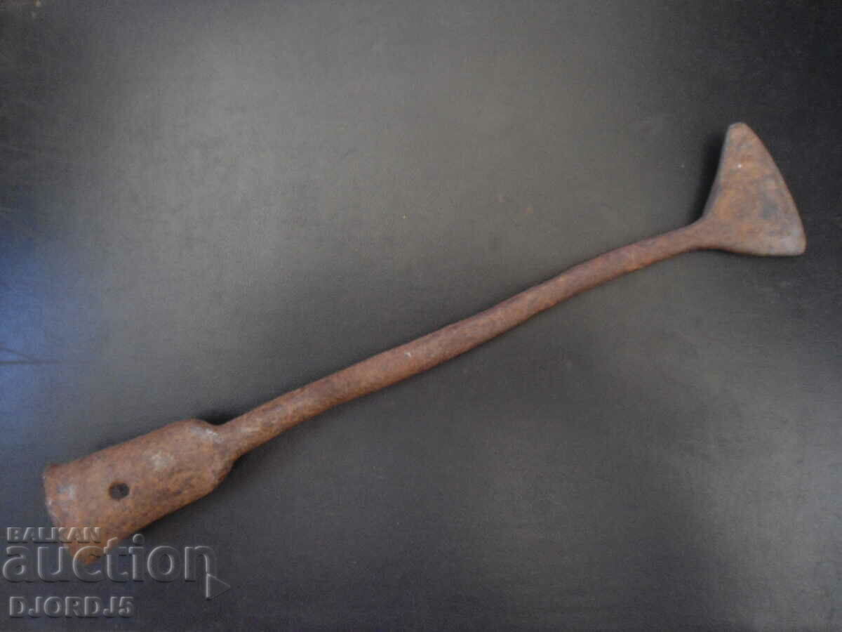 An old forged tool, a scabbard