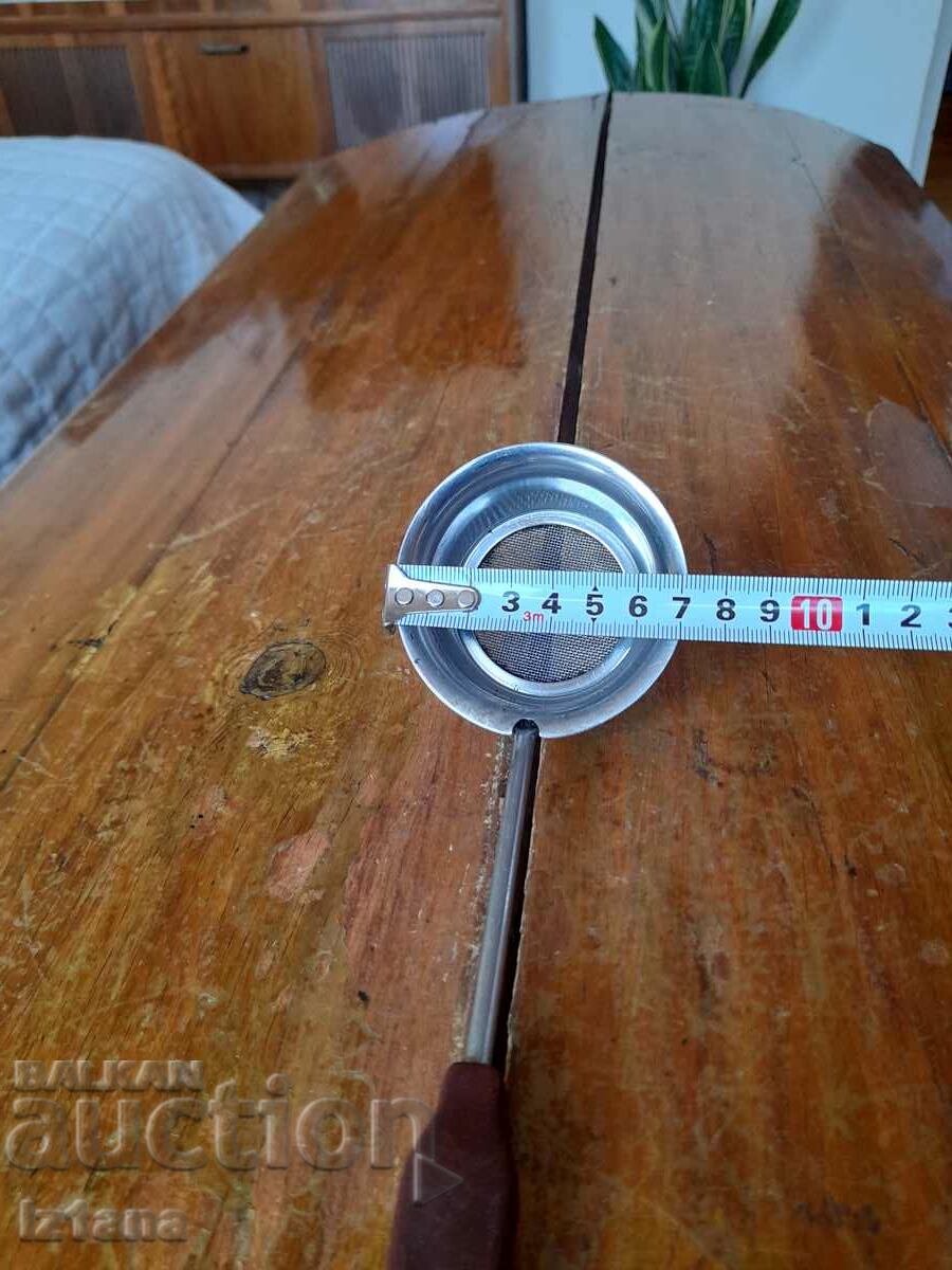 Auction  An old colander