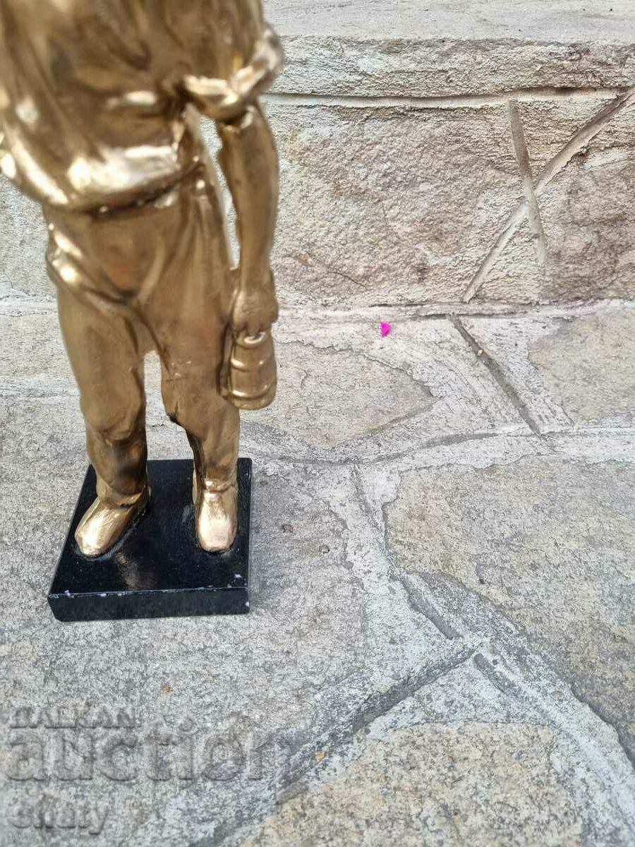 Delivery of Old metal sculpture. Figure