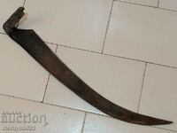 Old hand-forged mowing scythe, wrought iron
