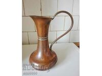 A beautiful, large copper jug.