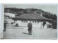 Photograph of a man in the village center 1934