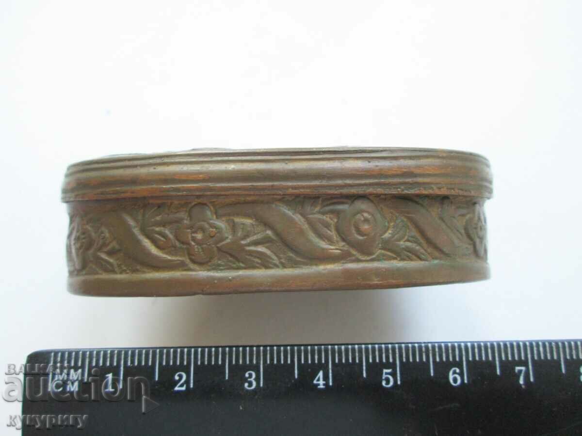 Auction A small elliptical copper box with folk motifs Auction A small elliptical copper box with folk motifs