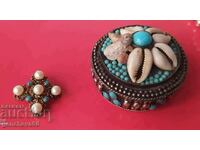 Old metal jewelry box and brooch