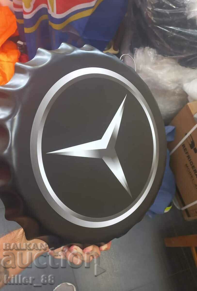 Metal plate in the shape of a Mercedes cap