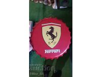 Metal plate in the shape of a Ferrari cap